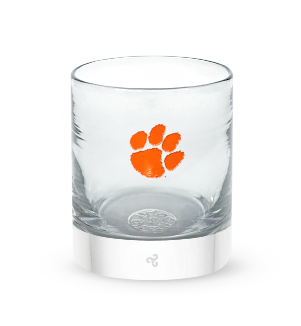 Clemson rocker, clear hand-blown lowball drinking glass with Clemson University paw print logo hand-etched in orange.