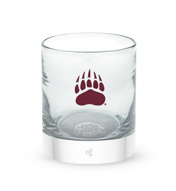 Montana rocker, clear hand-blown lowball drinking glass with University of Montana bear paw print logo hand-etched in crimson.