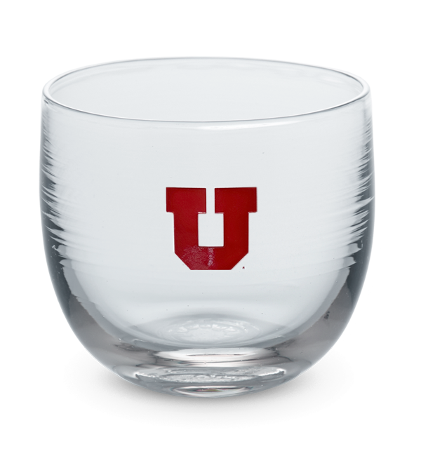 Utah drinker, clear hand-blown stemless wine glass with University of Utah logo hand-etched in red.