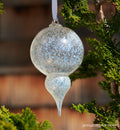 glassybaby ornament - double drop, white and gold aventurine hand-blown glass holiday ornament in a double-drop shape. on a white ribbon on a green fern tree.