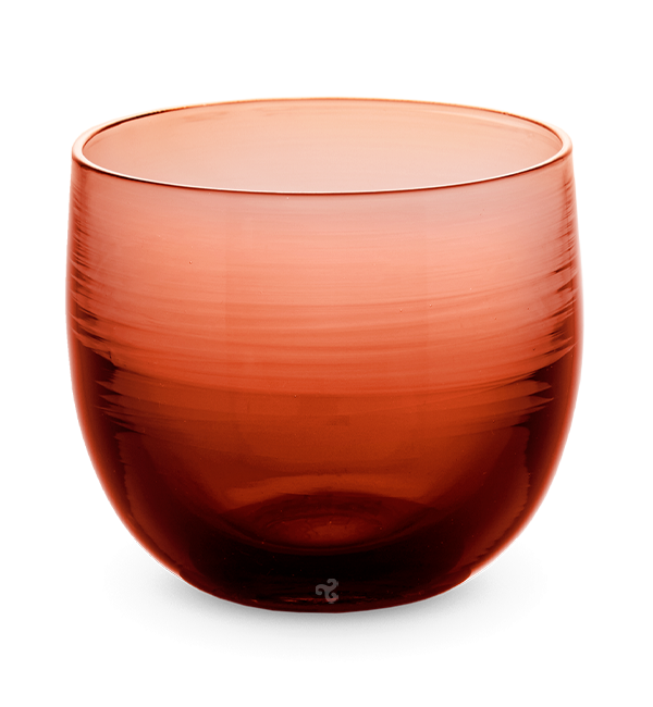 hard cider drinker, transparent deep red brown hand-blown drinking glass.