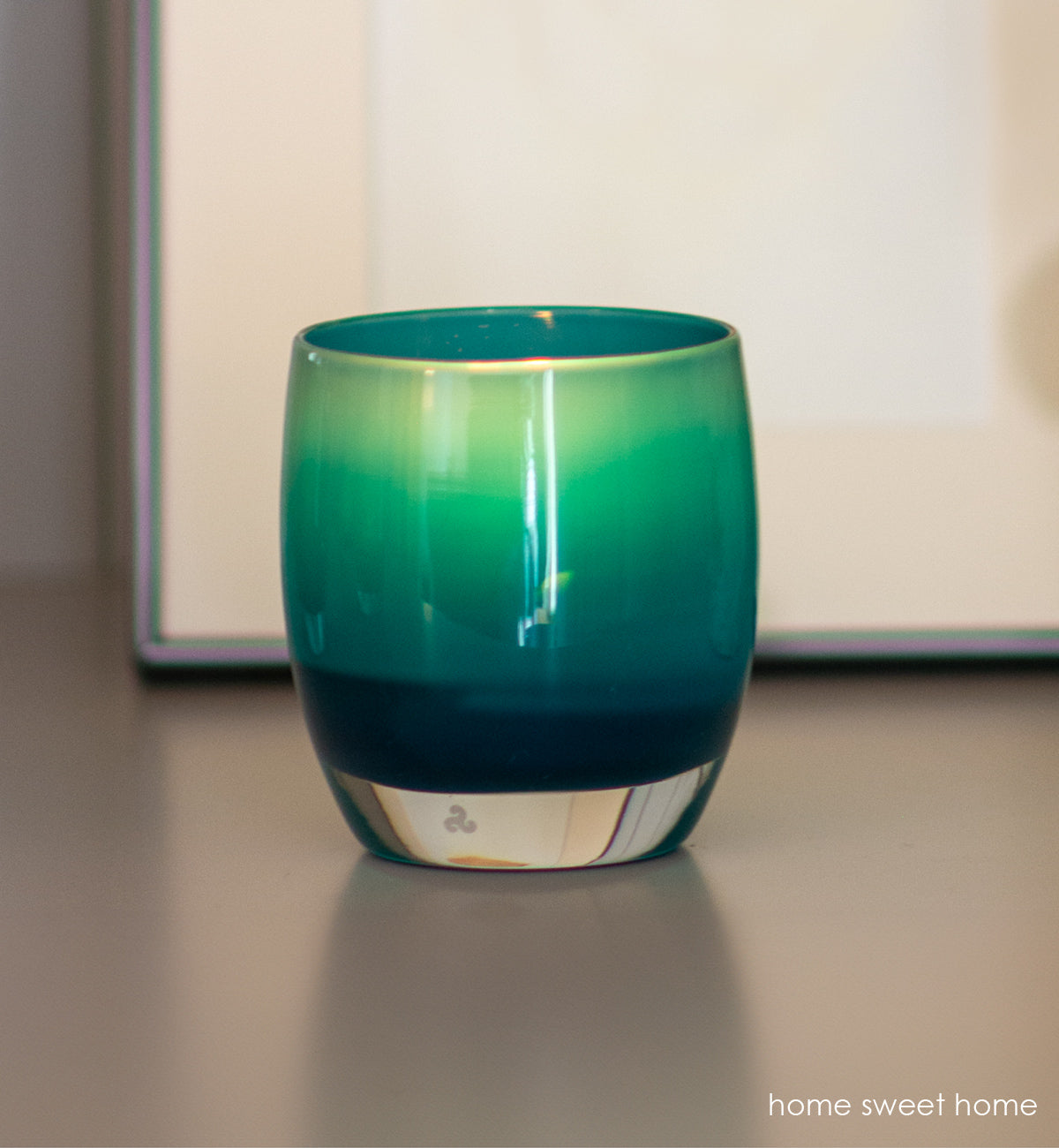 three home sweet home deep blue, hand-blown glass votive candle holders on a white mantle 