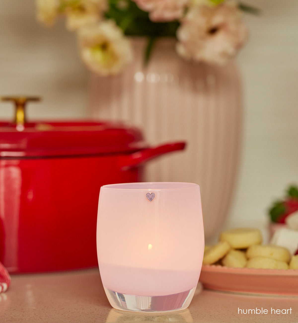 humble heart is a light pink glass-blown candle votive with a etched heart on it that is hand-painted.