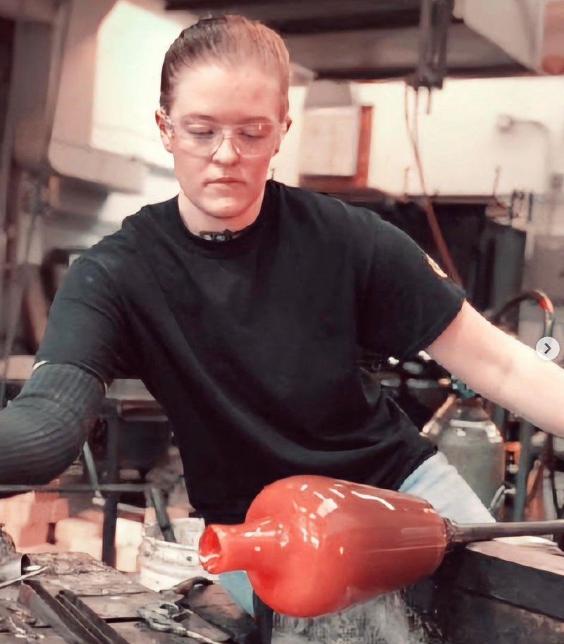 glassblower Karlie in a glassybaby hotshop creating a piece of her very own hand-blown art