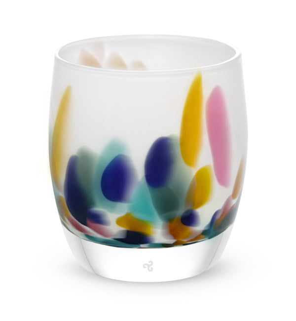 mahalo, white with multi-colored yellow, pink, teal, purple and green petals hand-blown glass votive candle holder.
