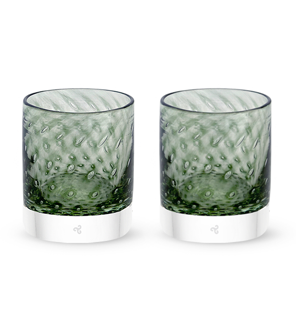 two Speakeasy rockers, dark transparent green with bubble pattern hand-blown glass lowball drinking glasses.